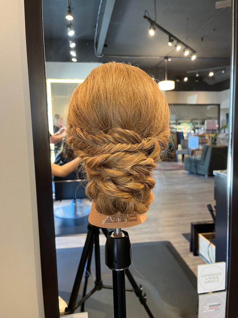 Crown braided updo on long blonde mannequin