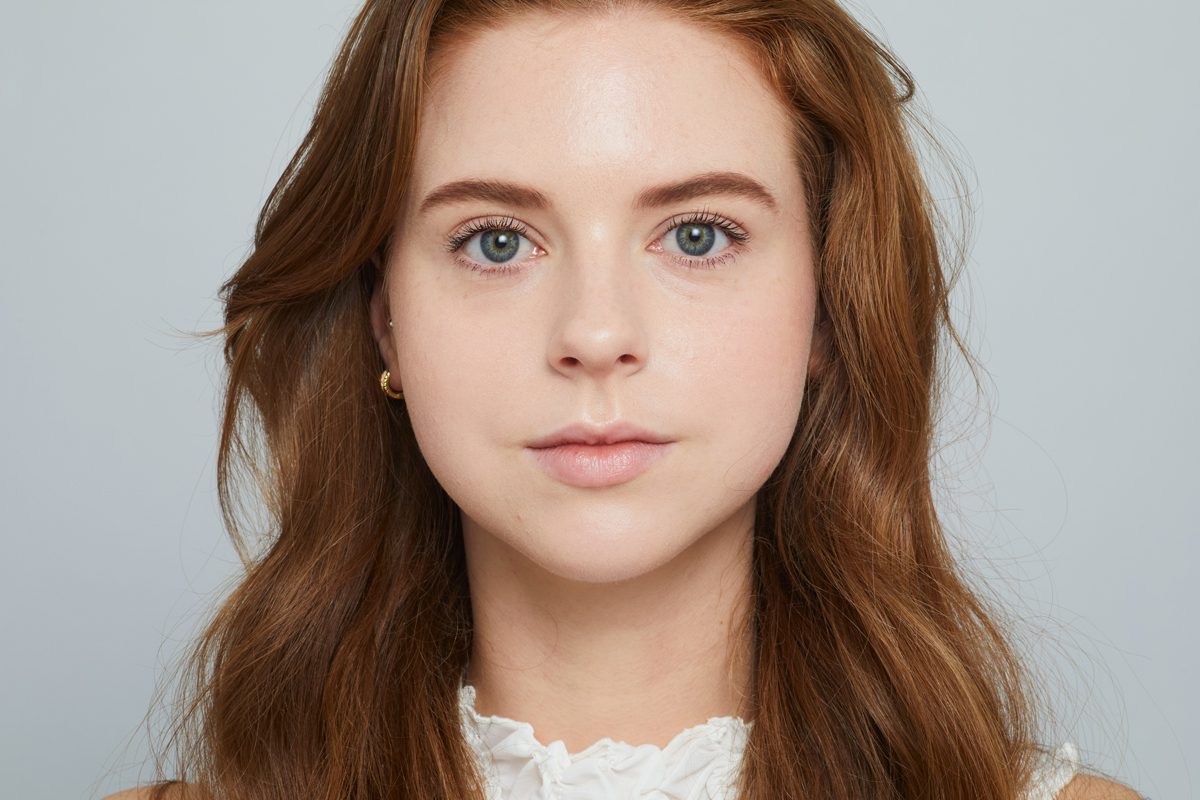 Woman with luminous satin sheen skin wearing Jane Iredale makeup.