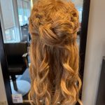 Half-crown braid and curls on long blonde mannequin - back view.