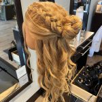 Half-crown braid and curls on long blonde mannequin-left side