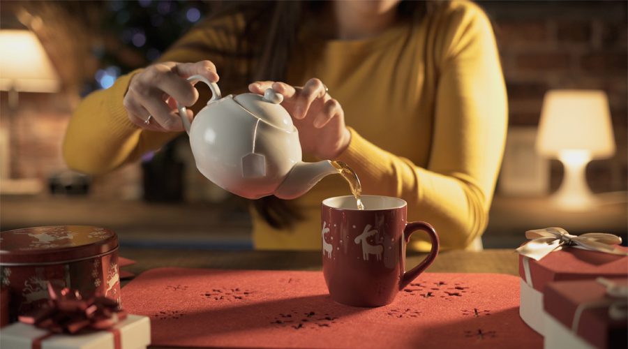 Picture of person pouring tea at home